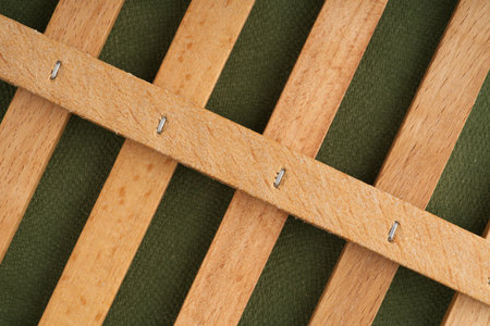 Wooden cage on a green background. Closeupの写真素材