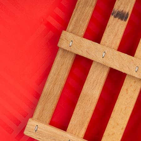Wooden cage on a red background. Closeupの写真素材
