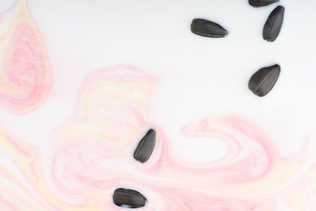 Abstract background in the form of paints dissolved in a white liquid. View from above. Closeup.の写真素材
