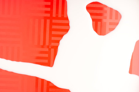 Abstract background of white liquid on a red background. View from above. Closeupの写真素材