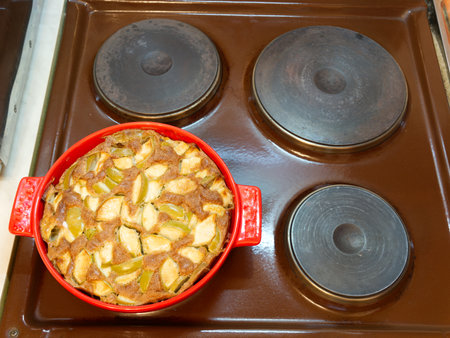 Apple pie on an old cooking stoveの写真素材