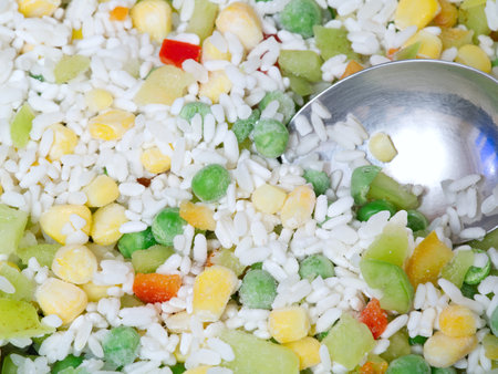 The texture of the Hawaiian mixture and spoon . Rice and vegetables. Closeupの写真素材