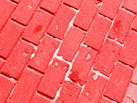 The texture of the pavement made of rectangular stones in red. Close. Abstractionの写真素材