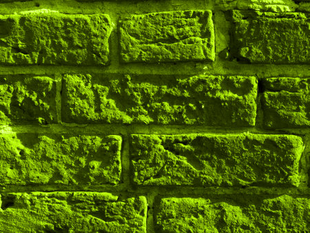 Abstract green texture made of bricks and black stripes. Close.の写真素材