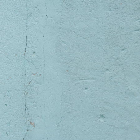 The texture of the wall is blue with damage. Close. With a crack on the left side going from top to bottom.の写真素材