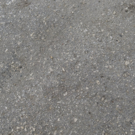 The texture of the gray cement wall with stones frozen inside. Close.の写真素材