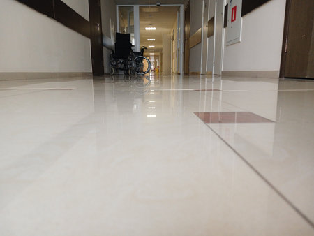 The corridor of the hospital. Wheelchairs are visible. The picture was taken from the floor.の写真素材