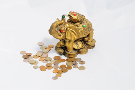 Ancient figurine bronze elephant with frog isolated on coins .の写真素材