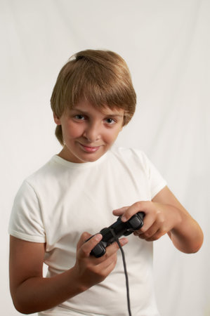 Teenage boy playing video game .