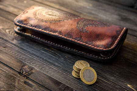 men's wallet money in cash wooden white vintage background.の写真素材