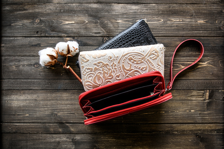 Group colorful Wallet of Leather skin on wooden backgroundの写真素材
