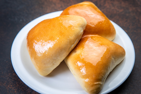 assorted fresh lush buns and pies.の写真素材