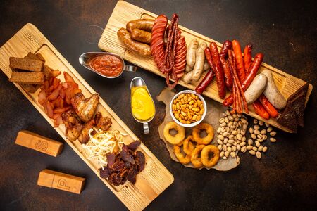 Assortment of beer snacks close up on counterの写真素材