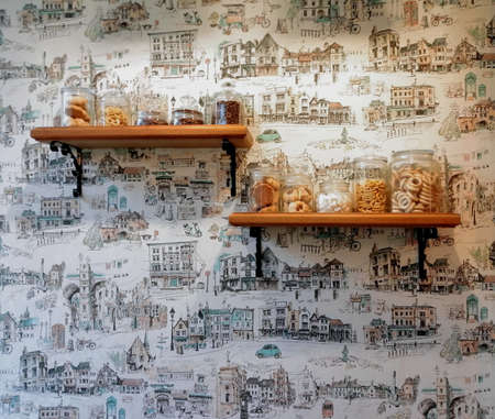 fragment of a modern kitchen interior on a background of cheerful wallpaperの写真素材