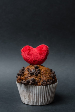 chocolate muffins with heart  on a dark backgroundの写真素材