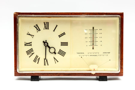 old table clock with thermometerの写真素材