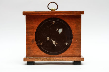 back side old table clock on a white backgroundの写真素材