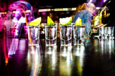 four glasses with Lim on the bar at a nightclubの写真素材
