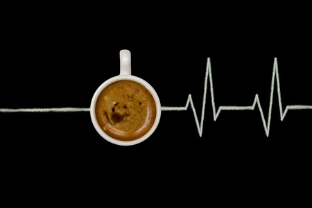 Invigorating cup of coffee on a dark background, conceptの写真素材
