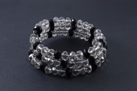 bracelet made of transparent beads isolated on blackの写真素材