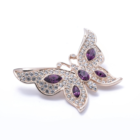 brooch in the shape of a butterfly on a white backgroundの写真素材