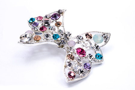 brooch with a bow of Gems isolated on whiteの写真素材