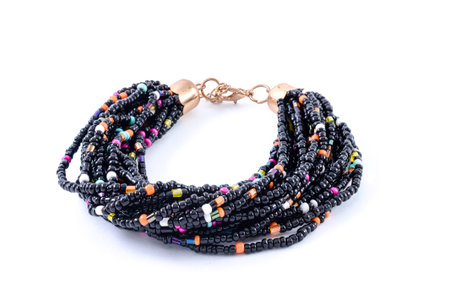 bracelet of colored beads isolated on whiteの写真素材