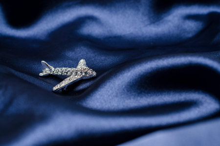 aircraft  brooch on silkの写真素材