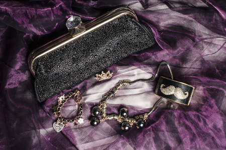 set of women's accessories on a silk backgroundの写真素材