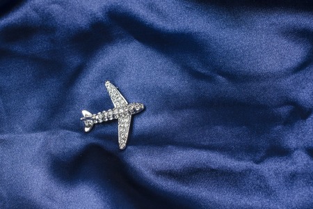 aircraft  brooch on silkの写真素材