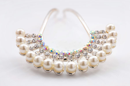 Barrette with pearls and diamonds on a white backgroundの写真素材