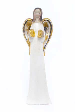 Christmas angel statuette isolated on whiteの写真素材