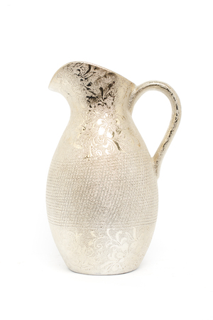 gold jug isolated on whiteの写真素材