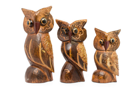 Wooden owl isolated on whiteの写真素材