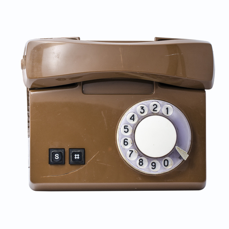 Old rotary phone isolated on whiteの写真素材