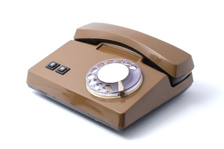 Old rotary phone isolated on whiteの写真素材