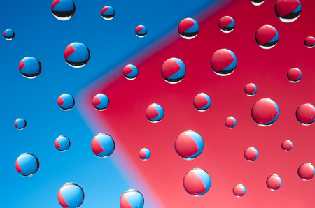 multicolored drops of water on color  backgroundの写真素材