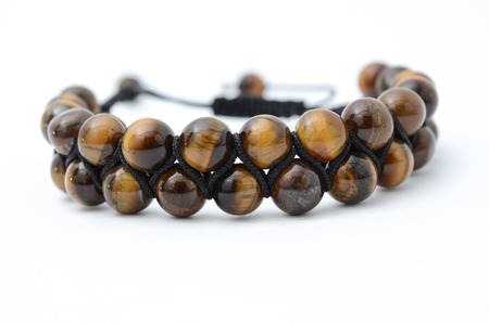 bracelet with wooden beads isolatedの写真素材