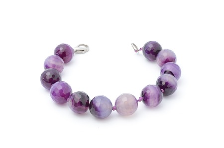 Bracelet with purple beads isolatedの写真素材