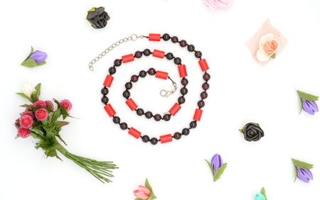 beads and flowers on whiteの写真素材