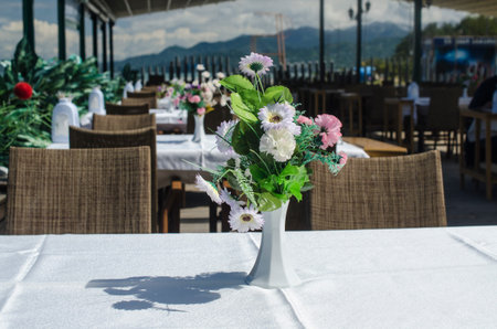 bouquet of flowers on a table in a summer cafe