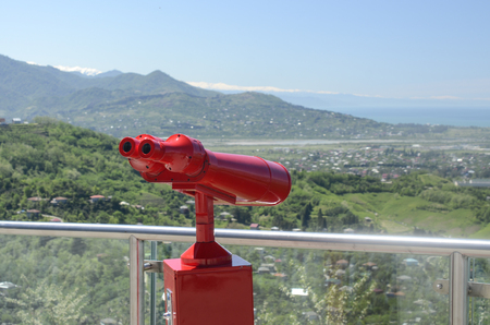 Binoculars with wonderful view, red binoculars for viewingの写真素材