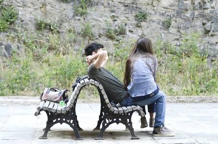 Young couple resting. couple on the benchの写真素材