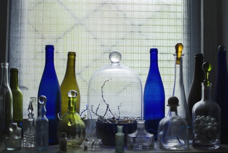 still life with colored bottlesの写真素材