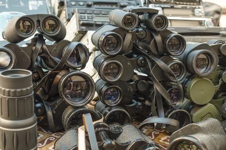 many old binoculars, stack of binocularsの写真素材