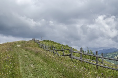 fence along rural roadの写真素材