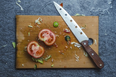 Still life with tomatoes and a knife.の写真素材