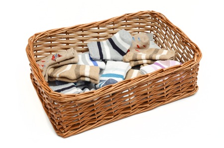 basket with socks isolated on whiteの写真素材