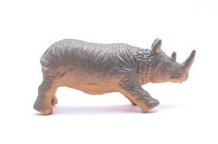 rhino toy isolated on whiteの写真素材