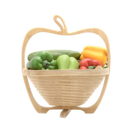wooden basket with artificial vegetables isolated on whiteの写真素材